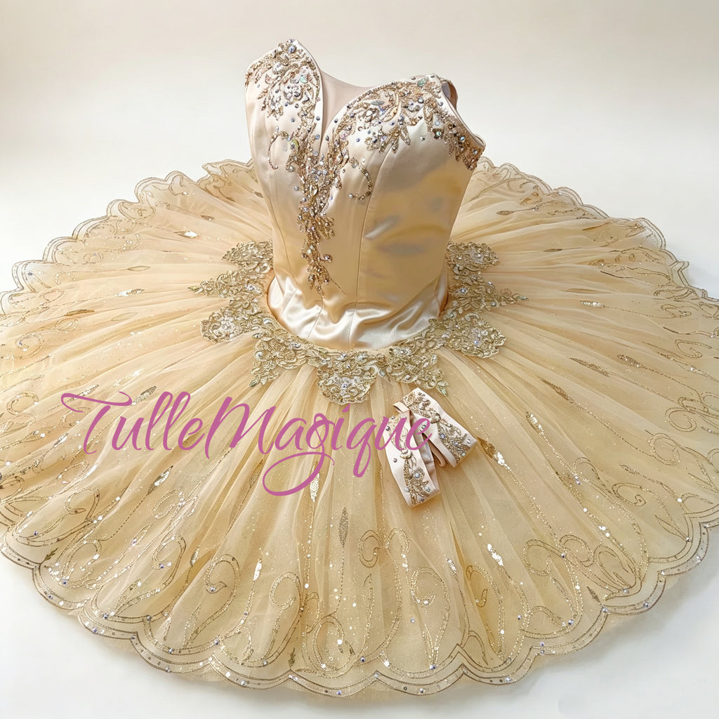 luxurious champagne tones with intricate gold-thread embroidery and shimmering crystal accents. It is the definitive choice for role of raymonda.