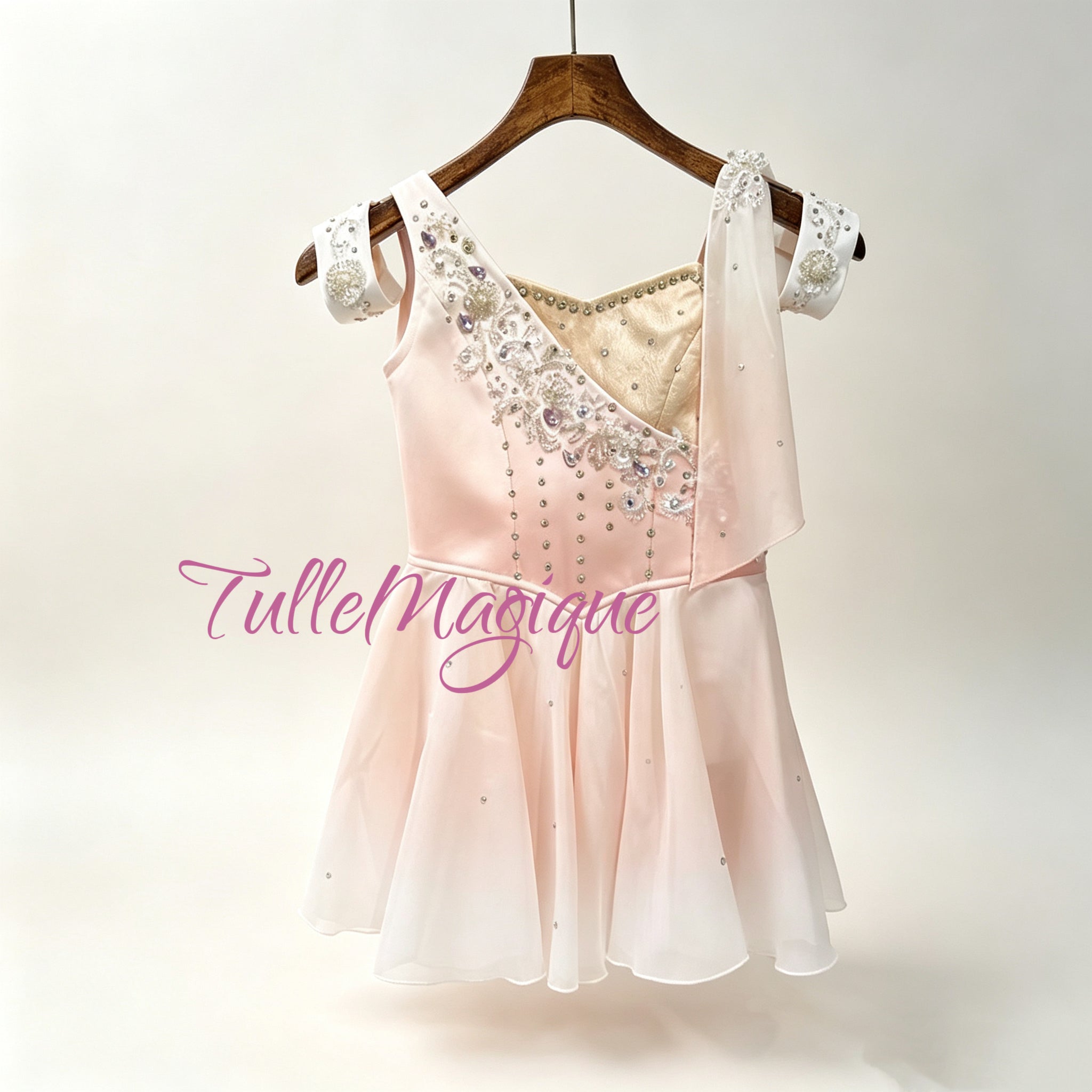 Professional Cupid ballet variation costume featuring a unique asymmetric bodice with peach pink satin and champagne gold brocade, decorated with silver vine
