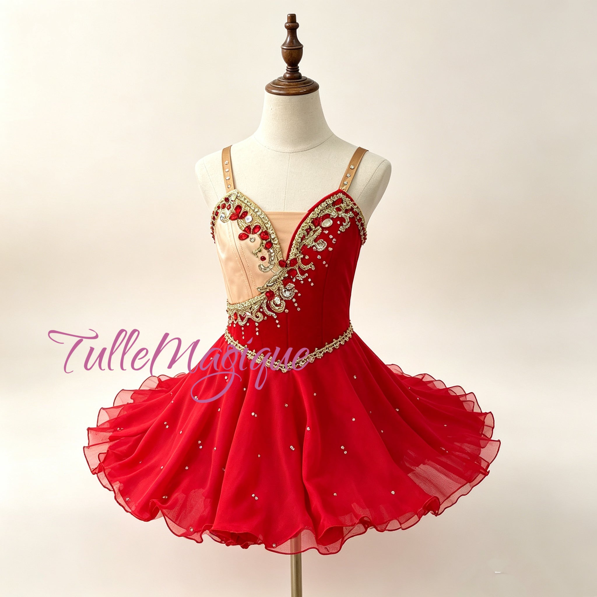 Greek style asymmetric ballet costume for Diana variation, showcasing a vibrant red and light gold cross-body bodice adorned with sparkling red rhinestones and a fluid tiered ripple short skirt