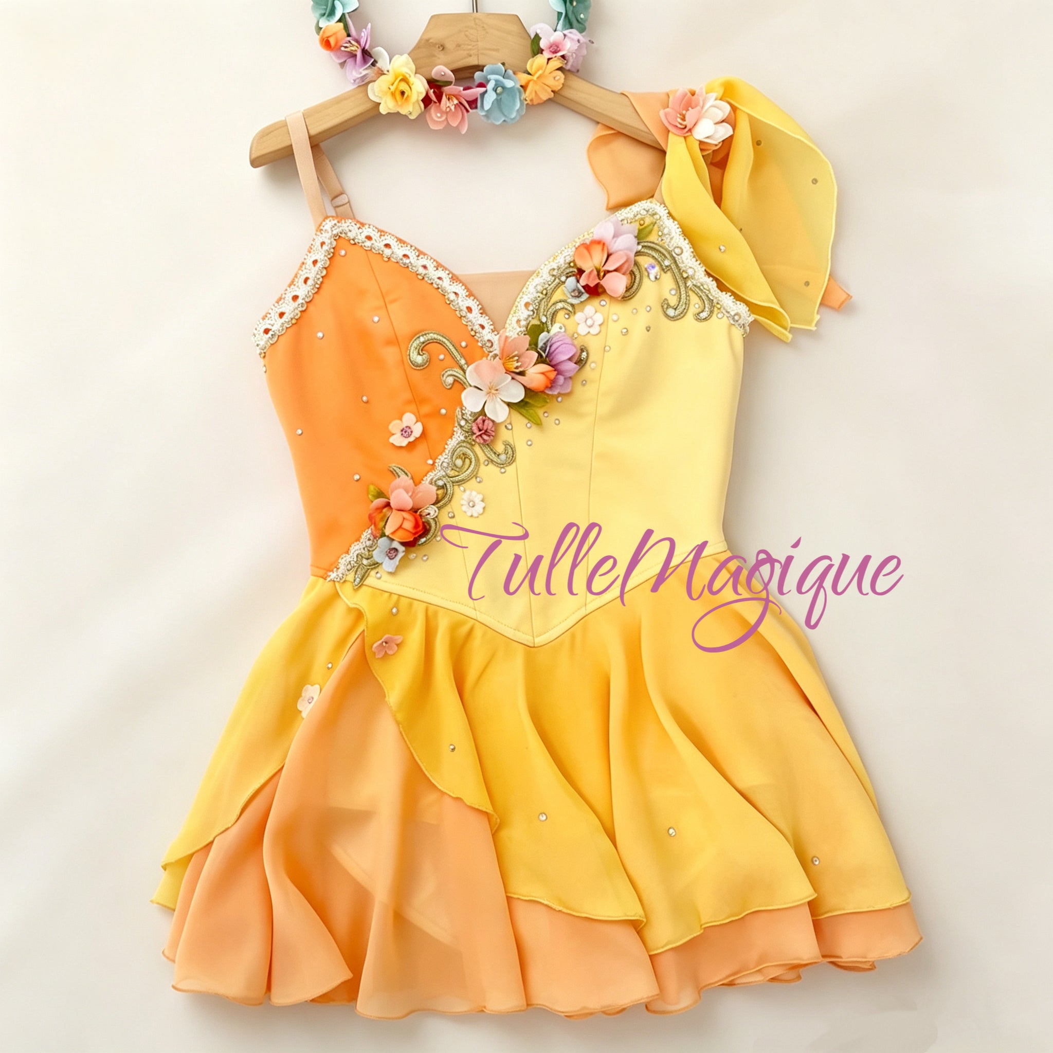 Professional yellow and orange Cupid variation ballet costume with an asymmetric bodice featuring colorful 3D handmade flowers, gold vine embroidery, and a layered chiffon chiton skirt