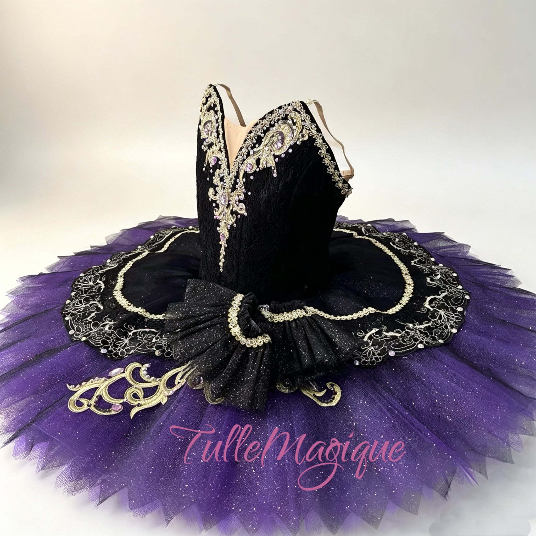 Luxury classical ballet tutu for the Carnival of Venice (Satanella) variation, featuring a dramatic black lace bodice with gold Baroque details and a brilliant violet pancake skirt for international competitions
