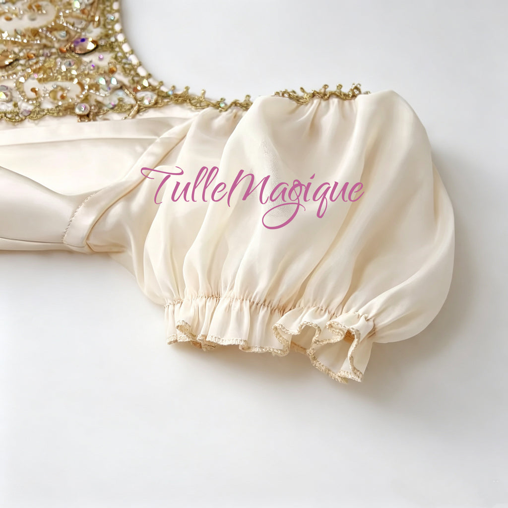 Luxury champagne and gold romantic ballet dress featuring a V-shaped bodice with exquisite gold embroidery and delicate puff sleeves,