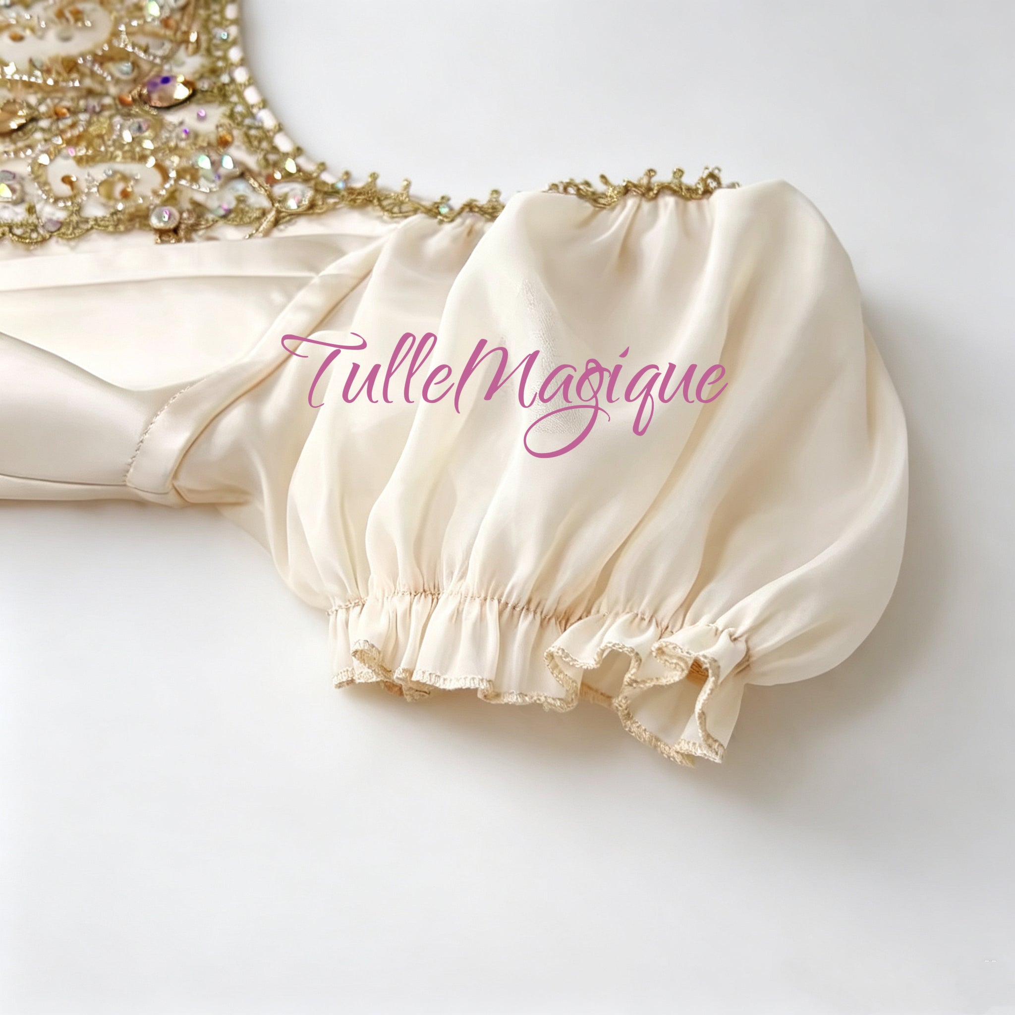 Luxury champagne and gold romantic ballet dress featuring a V-shaped bodice with exquisite gold embroidery and delicate puff sleeves,