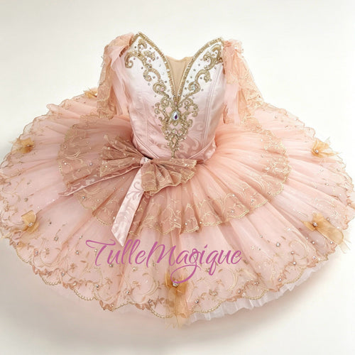 Professional champagne pink and gold classical ballet tutu for Princess Aurora variation, featuring a paneled satin bodice with gold baroque embroidery and a tiered lace platter skirt for YAGP.