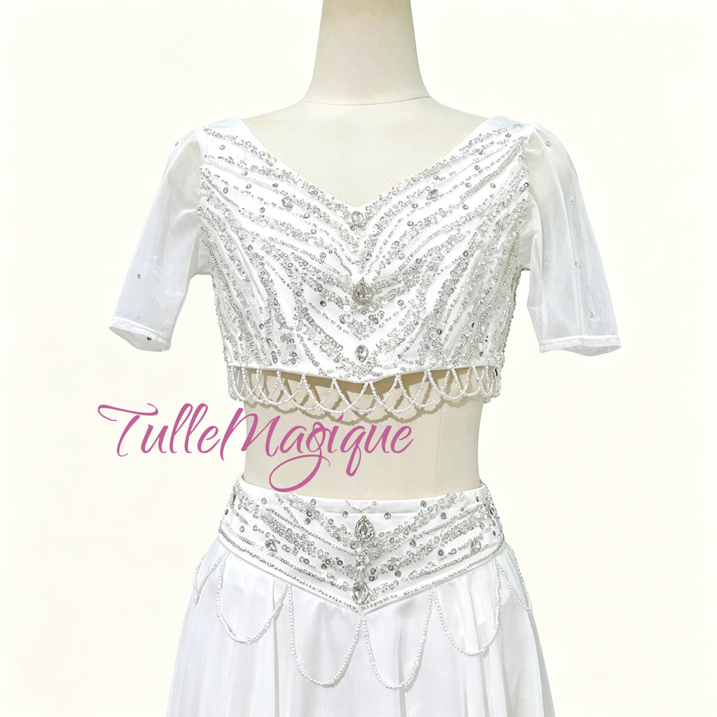 ⁠Close-up of TulleMagique white ballet bodice with luxury silver embroidery, short sleeves, and dangling beaded fringe.⁠