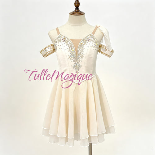 Professional cream-white Cupid variation ballet costume featuring a Grecian chiton style chiffon skirt and silver embellished bodice with crystals for stage performance and YAGP GCD competition 
