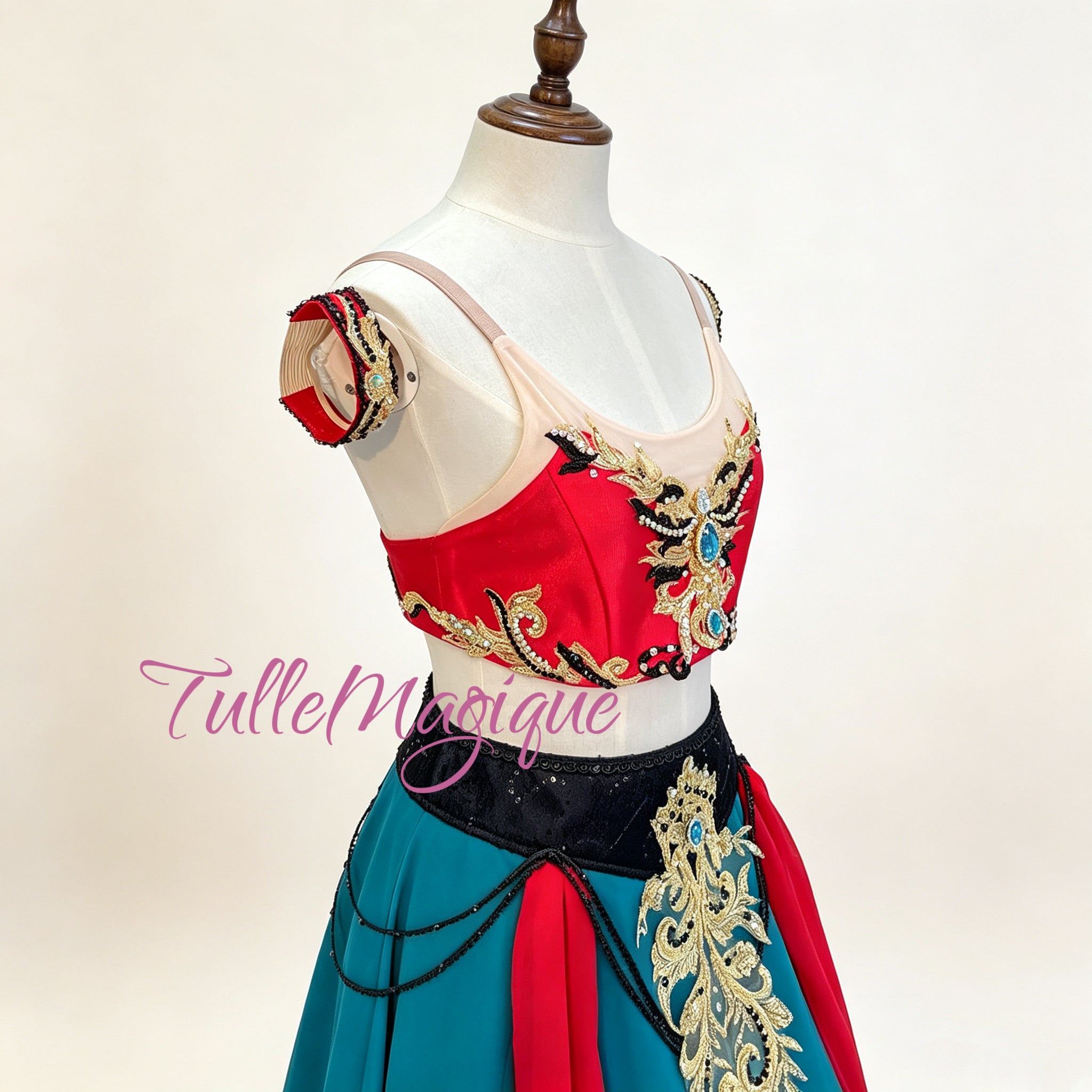 Close-up of intricate gold embroidery and beadwork on a professional lyrical character ballet costume.