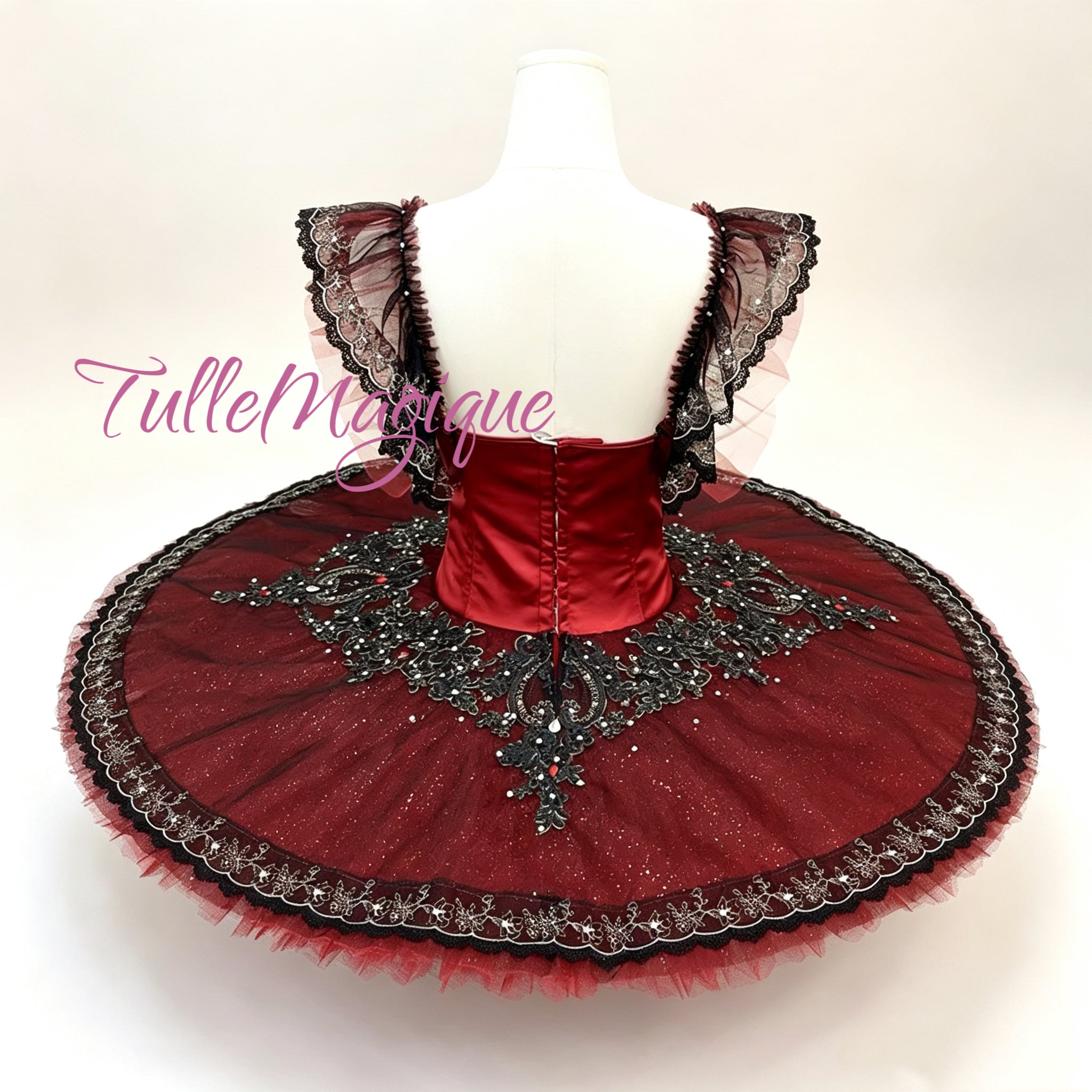 tutu.jpg	Elegant dark red classical tutu with intricate black embroidery for professional stage performance.