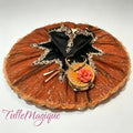 Professional deep orange and black classical ballet tutu for Laurencia tambourine variation, featuring a black satin bodice with gold baroque embroidery and a matching rose-trimmed tambourine accessory for YAGP