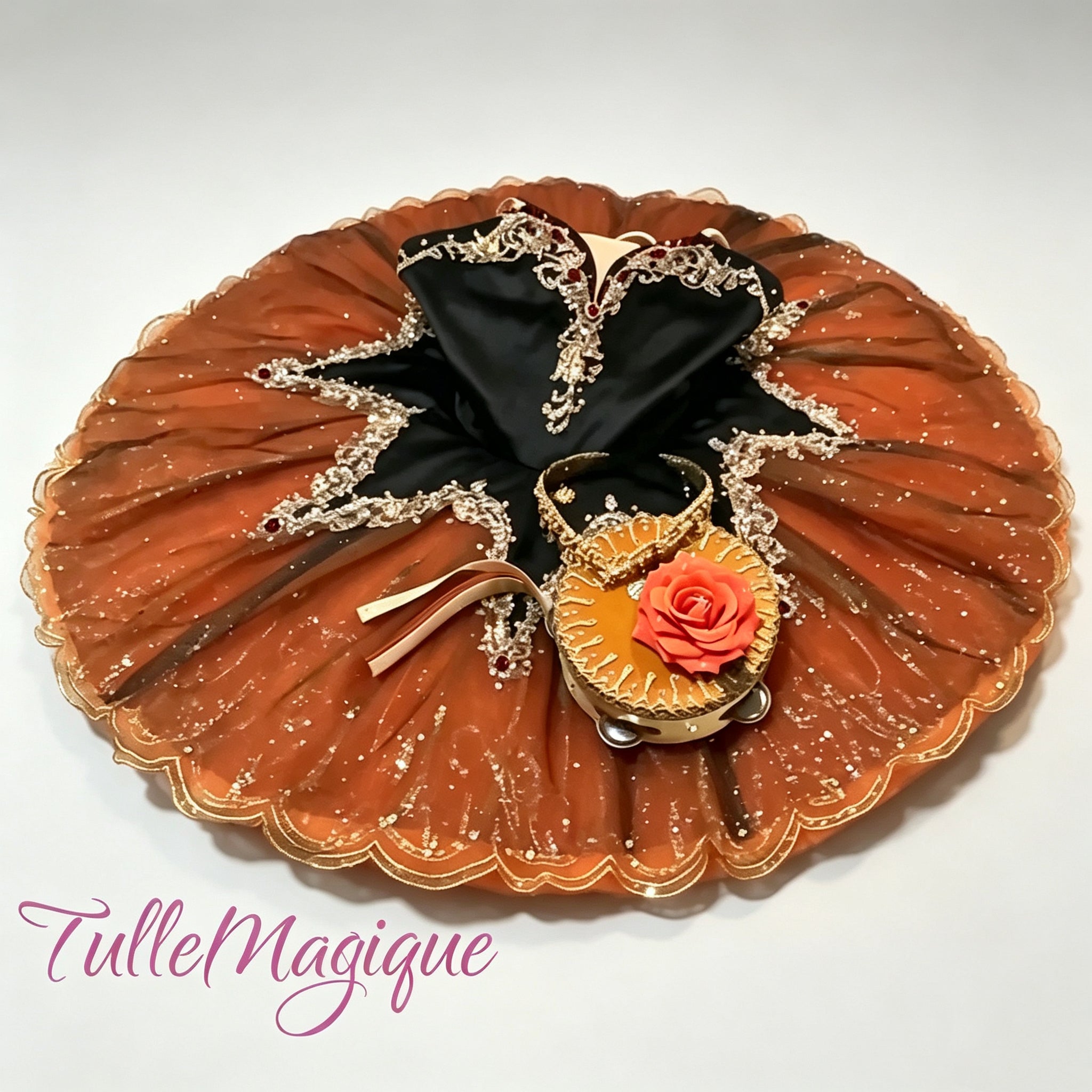 Professional deep orange and black classical ballet tutu for Laurencia tambourine variation, featuring a black satin bodice with gold baroque embroidery and a matching rose-trimmed tambourine accessory for YAGP
