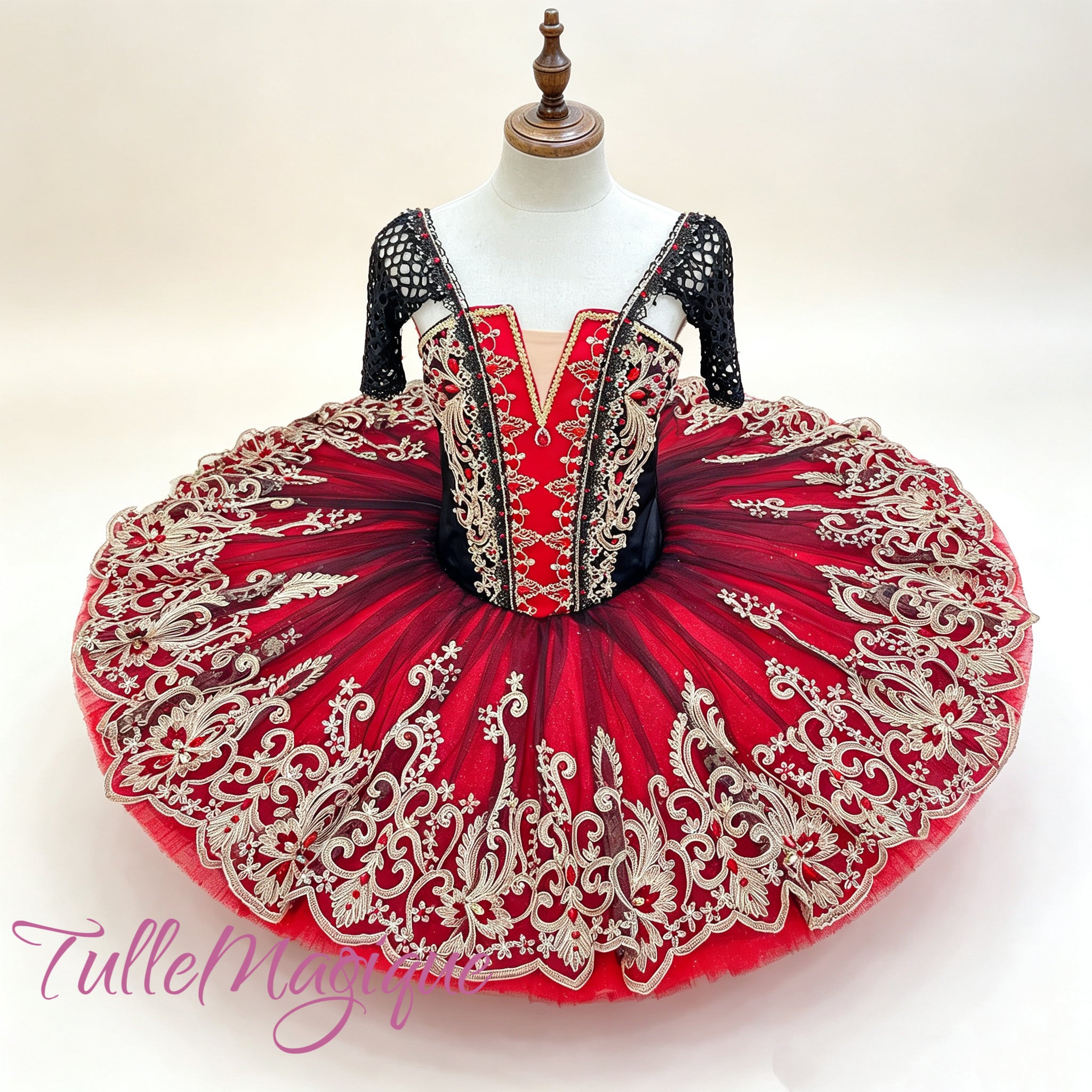 Handcrafted luxury red and black professional pancake tutu for Don Quixote Kitri Act 3 grand pas de deux wedding variation, adorned with opulent gold vine appliques and embedded scarlet crystals.