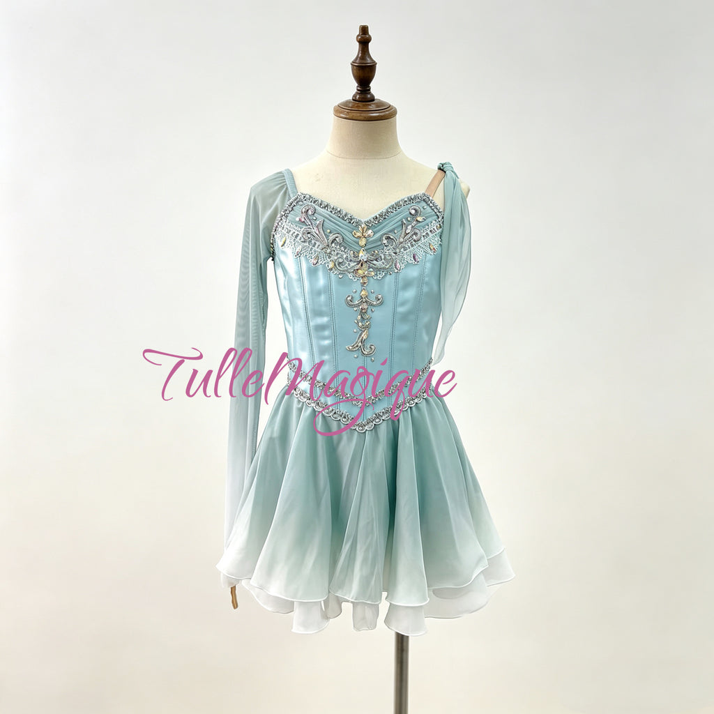 Professional ice blue Talisman ballet variation costume, featuring an asymmetric design with one light mesh long sleeve, a single shoulder drape, and heavy silver baroque bodice embroidery