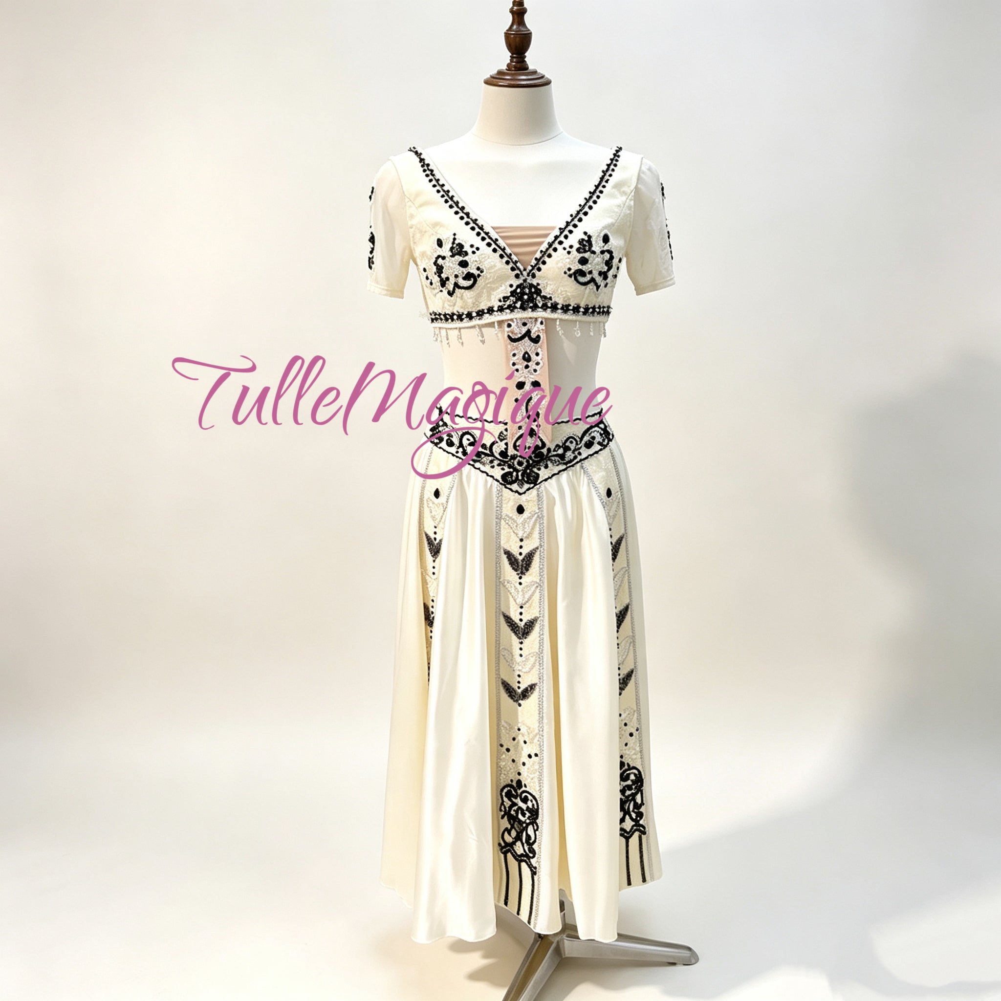 Crafted specifically for the theatrical demands of the Le Corsaire 'Pas d'Esclave' variation, this costume perfectly captures the exotic and regal aesthetic required for the role with the elegant black-and-white embroidery.