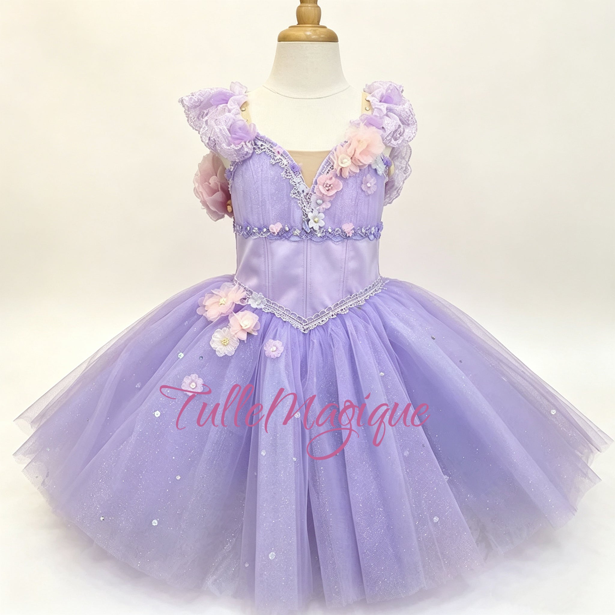 Professional lilac fairy romantic tutu for Sleeping Beauty variation, featuring lavender satin bodice with 3D floral accents, lace trim, and glitter tulle skirt by TulleMagique.