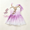 Professional lilac and white Talisman ballet variation costume, featuring a double ombre chiffon chiton skirt, a single shoulder drape, and an asymmetric gold vine embroidery on the bodice