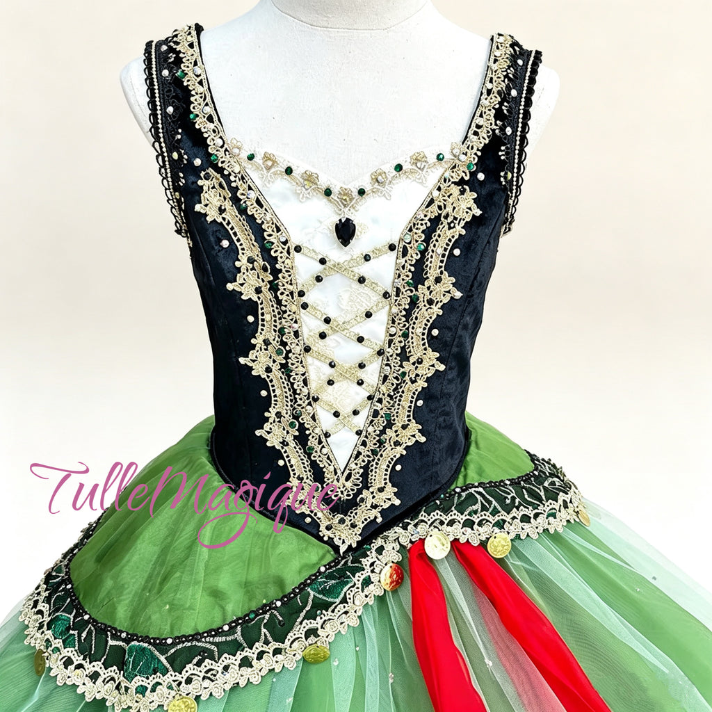 Emerald green and black romantic-length ballet tutu with a structured jeweled bodice and asymmetrical peplum for La Esmeralda. 