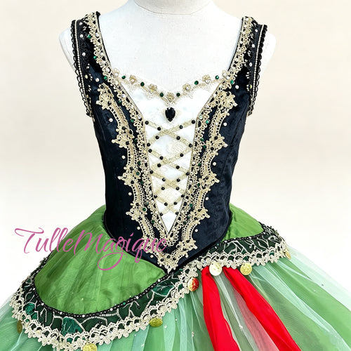 Emerald green and black romantic-length ballet tutu with a structured jeweled bodice and asymmetrical peplum for La Esmeralda. 