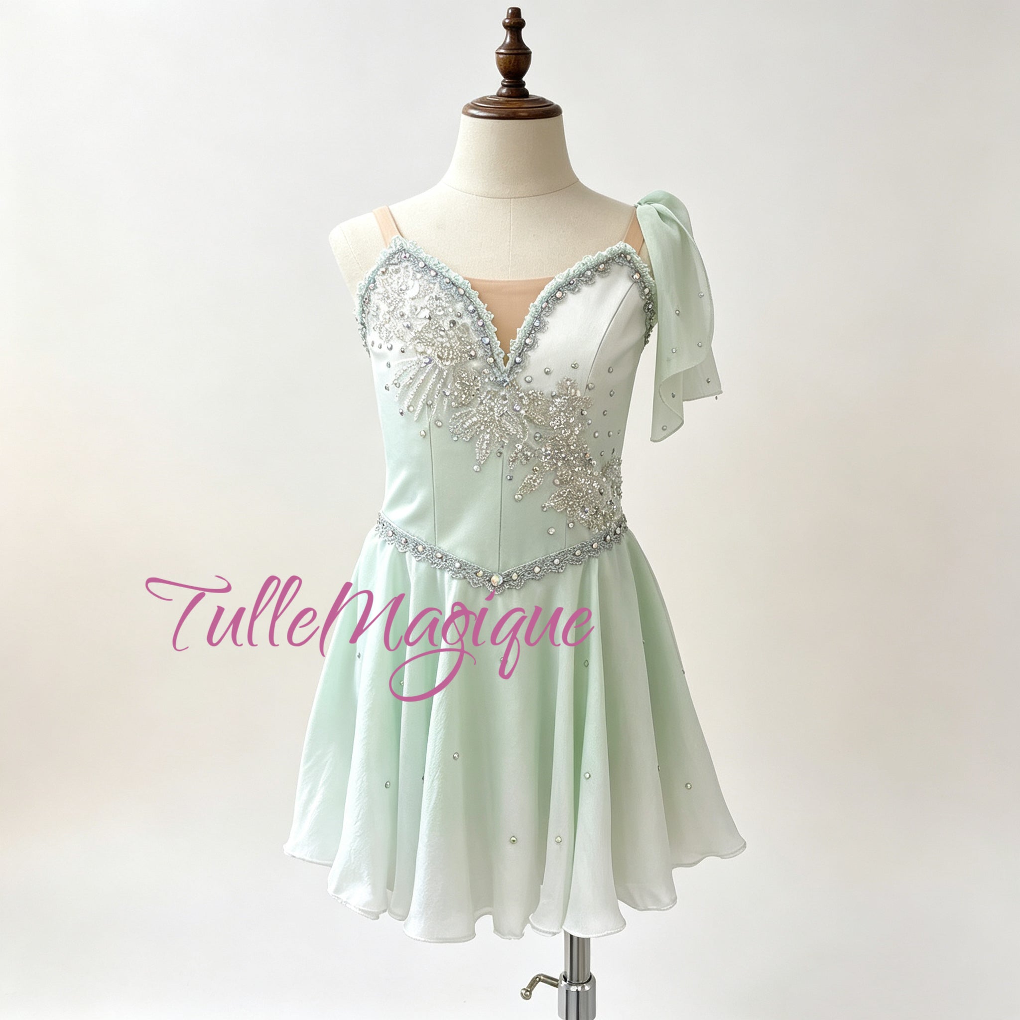 Professional mint green Water Spring ballet variation costume, featuring an asymmetric silver wave-like embroidery with crystals and a flowy layered chiffon skirt