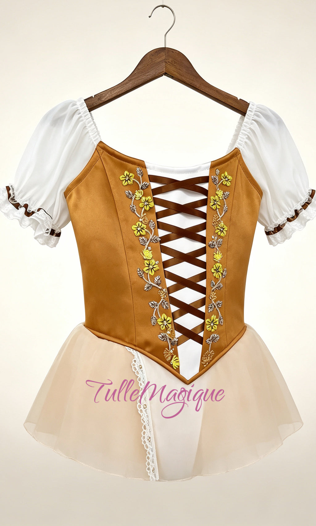 Close-up of the ochre velvet ballet bodice showcasing dark brown corset lacing, delicate yellow flower embroidery, and white chiffon puff sleeves.