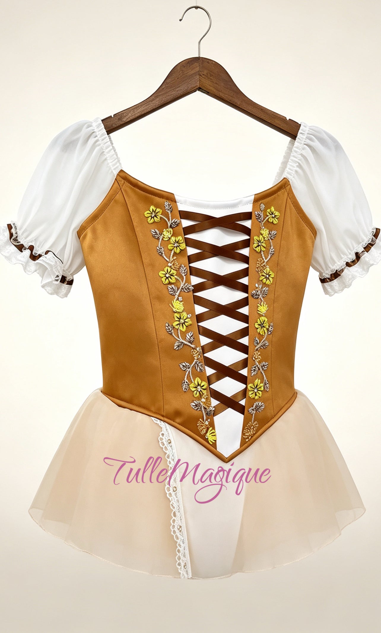 Close-up of the ochre velvet ballet bodice showcasing dark brown corset lacing, delicate yellow flower embroidery, and white chiffon puff sleeves.