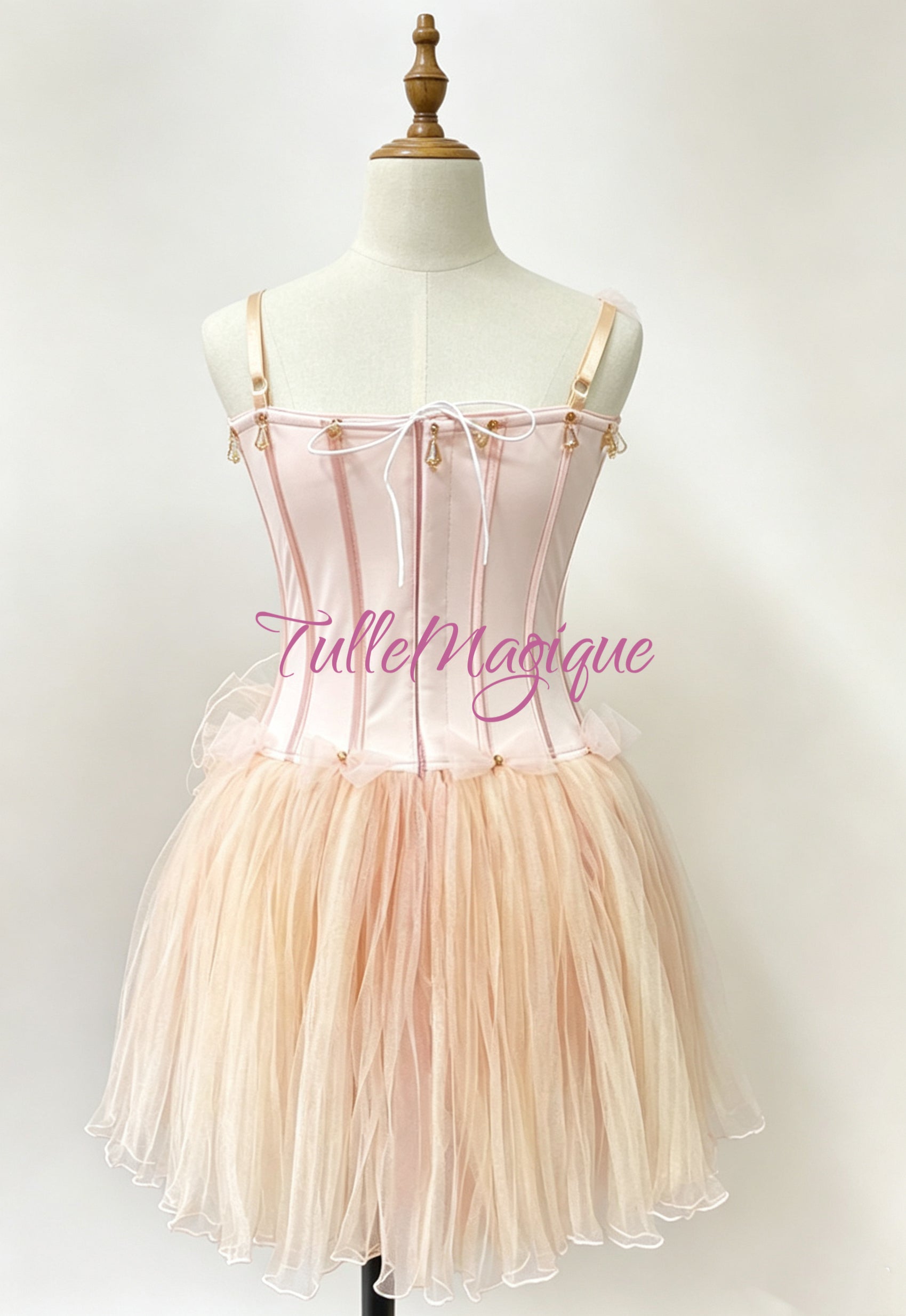 Peach color dew drop ballet costume back with hooks and eyes closure 
