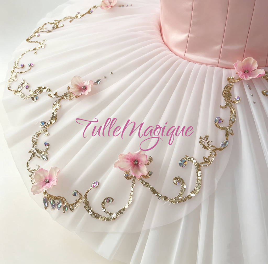 A gental soft pink color classical ballet tutu with pink flowers and gold appliques for princess Aurora and dew drop fairy.