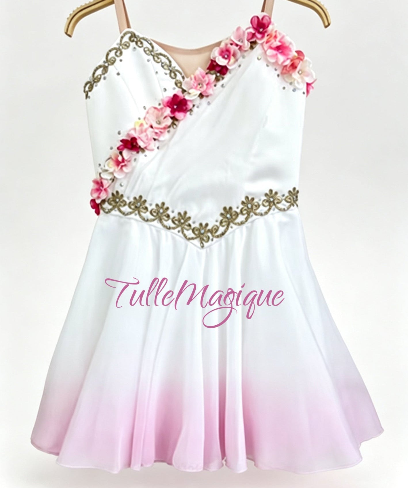 Greek style ballet tunic for lyrical and classical variations, showcasing a white and light pink ombre layered chiffon skirt, adorned with detailed gold embroidery and pink-white flowers.