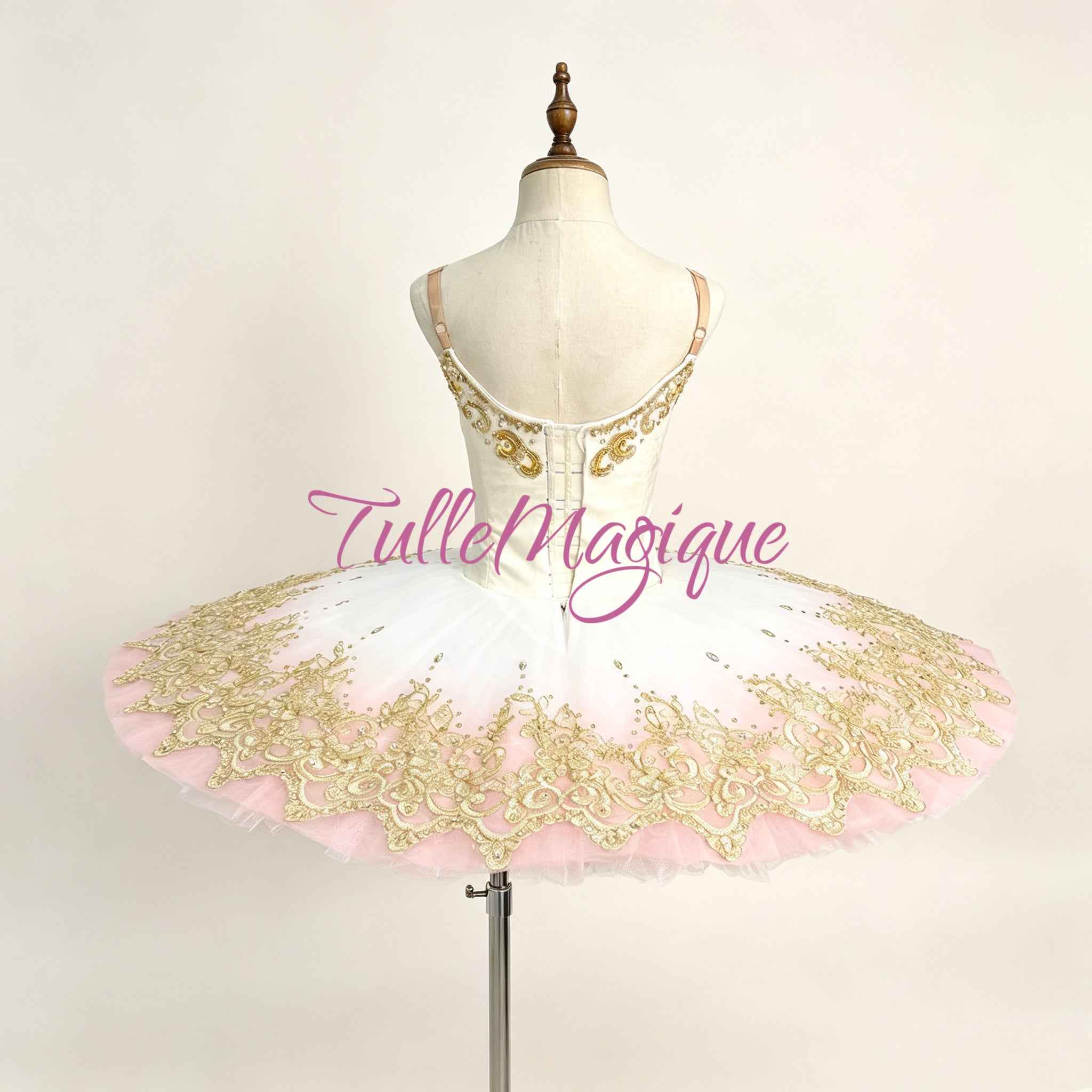 Professional classical ballet tutu in white and soft pink ombré with heavy gold embroidery and crystals, custom stage wear.