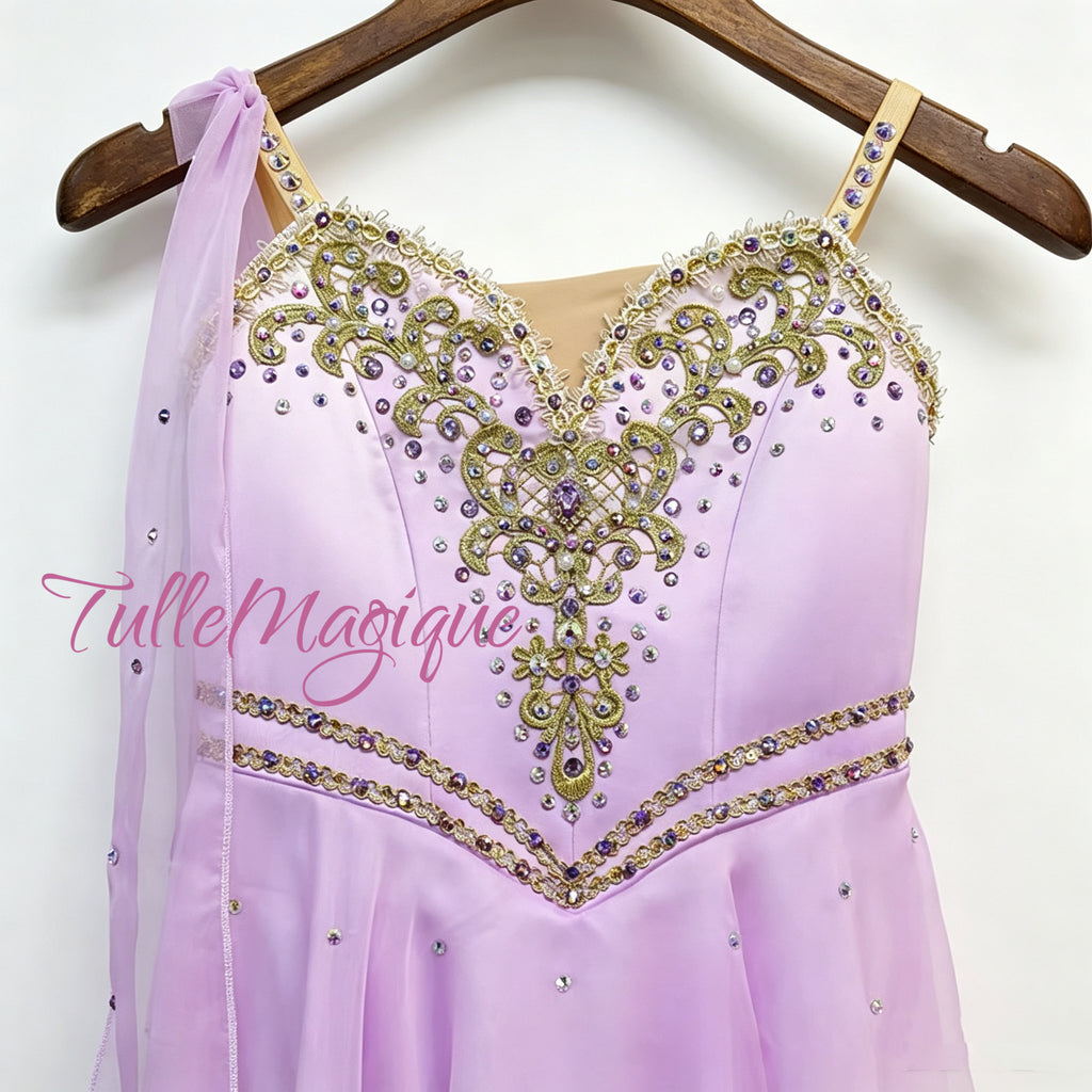 High-end custom-made professional ballet competition tunic in lavender and white ombre, featuring a sweetheart neckline with nude mesh and a dense layout of shining purple crystal