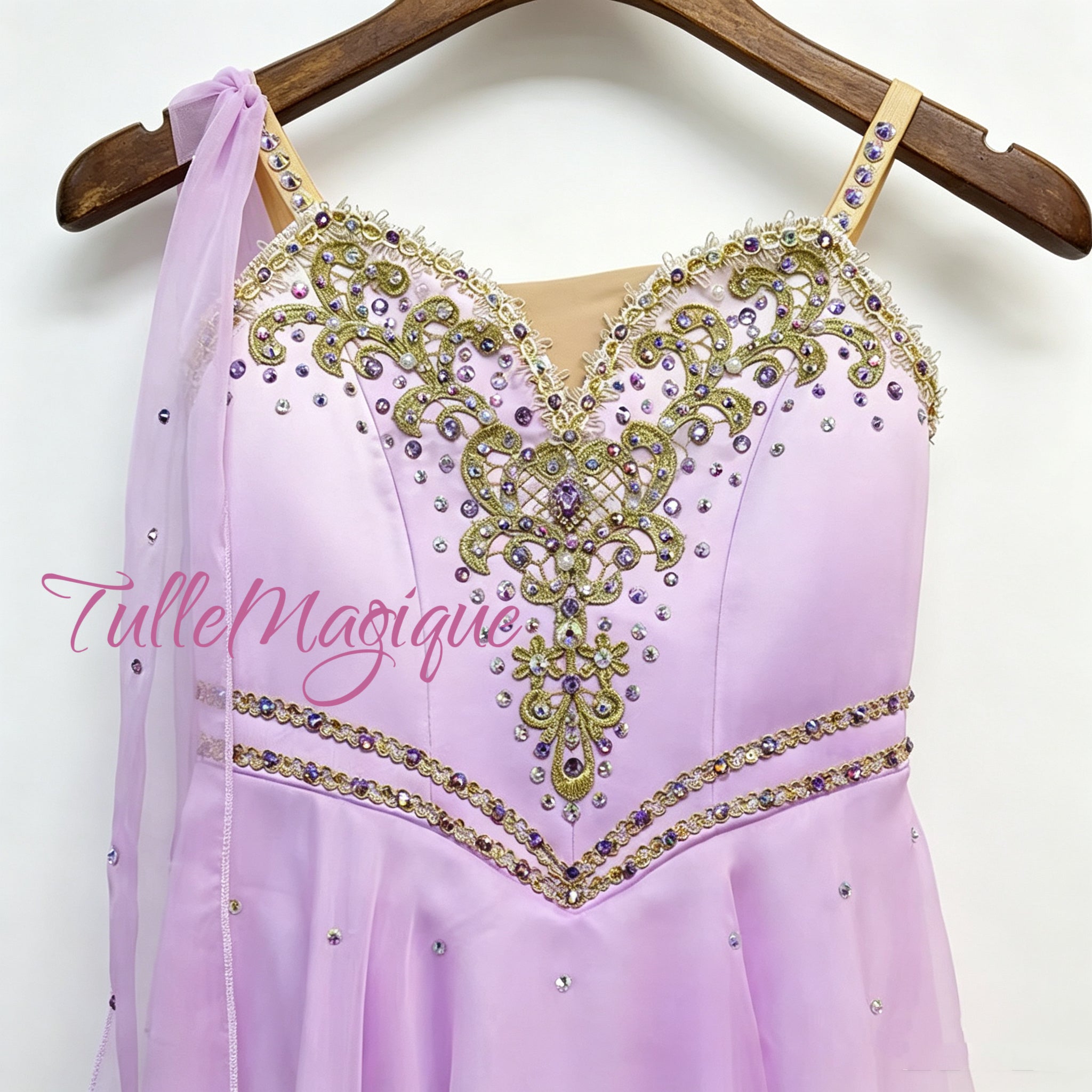High-end custom-made professional ballet competition tunic in lavender and white ombre, featuring a sweetheart neckline with nude mesh and a dense layout of shining purple crystal