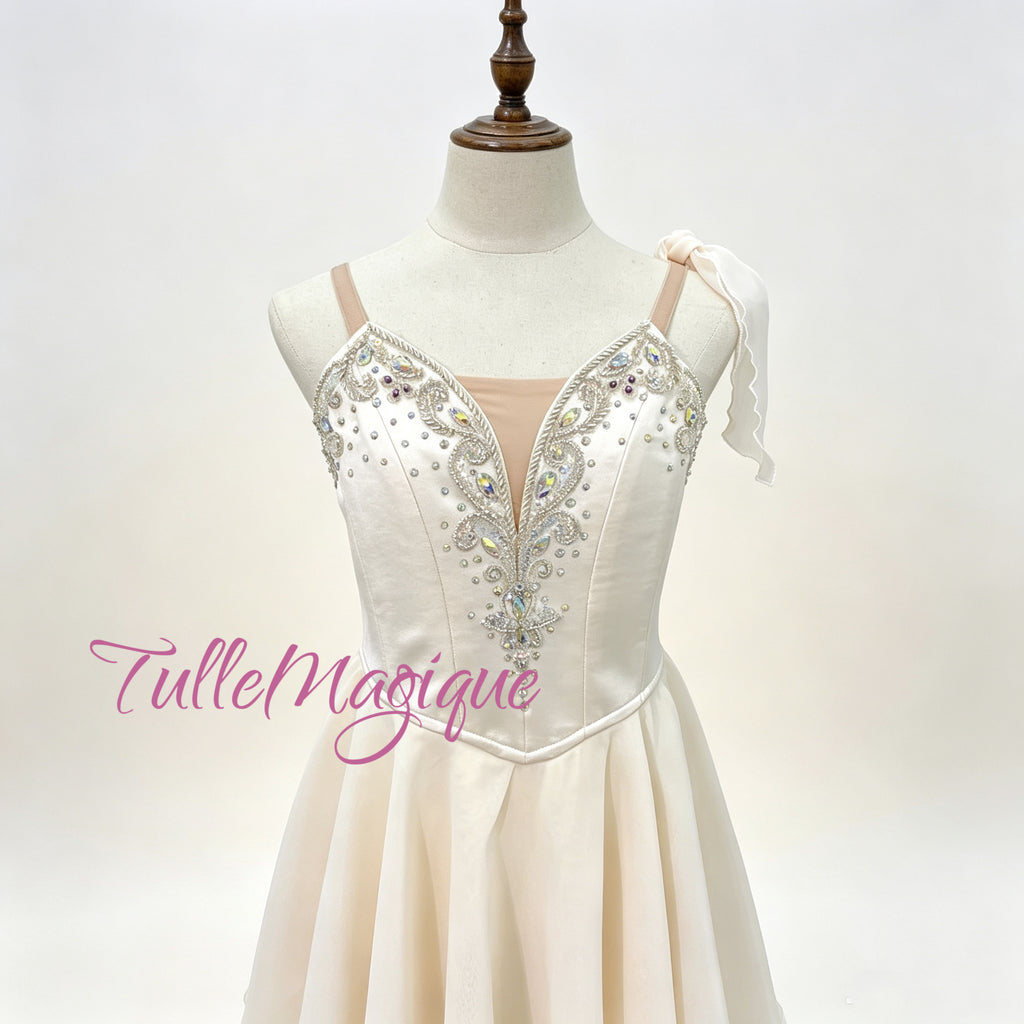 Custom made-to-measure professional ballet stage wear in Greek style, showing a detailed view of the crystal-encrusted bodice and flowy tiered chiffon skirt on a mannequin