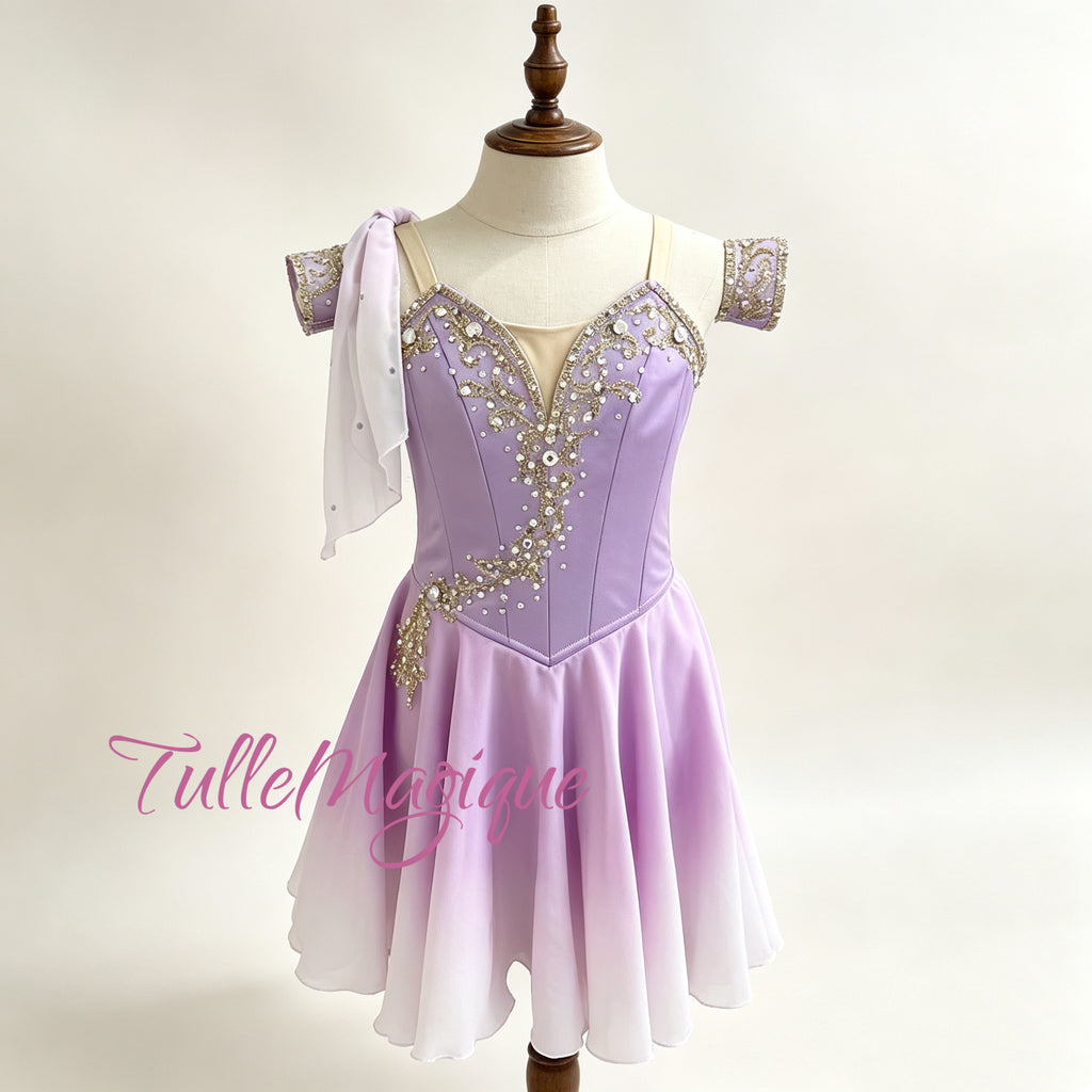 ⁠Custom professional purple ballet tunic dress for YAGP competition with golden appliqué and a single-shoulder drape.