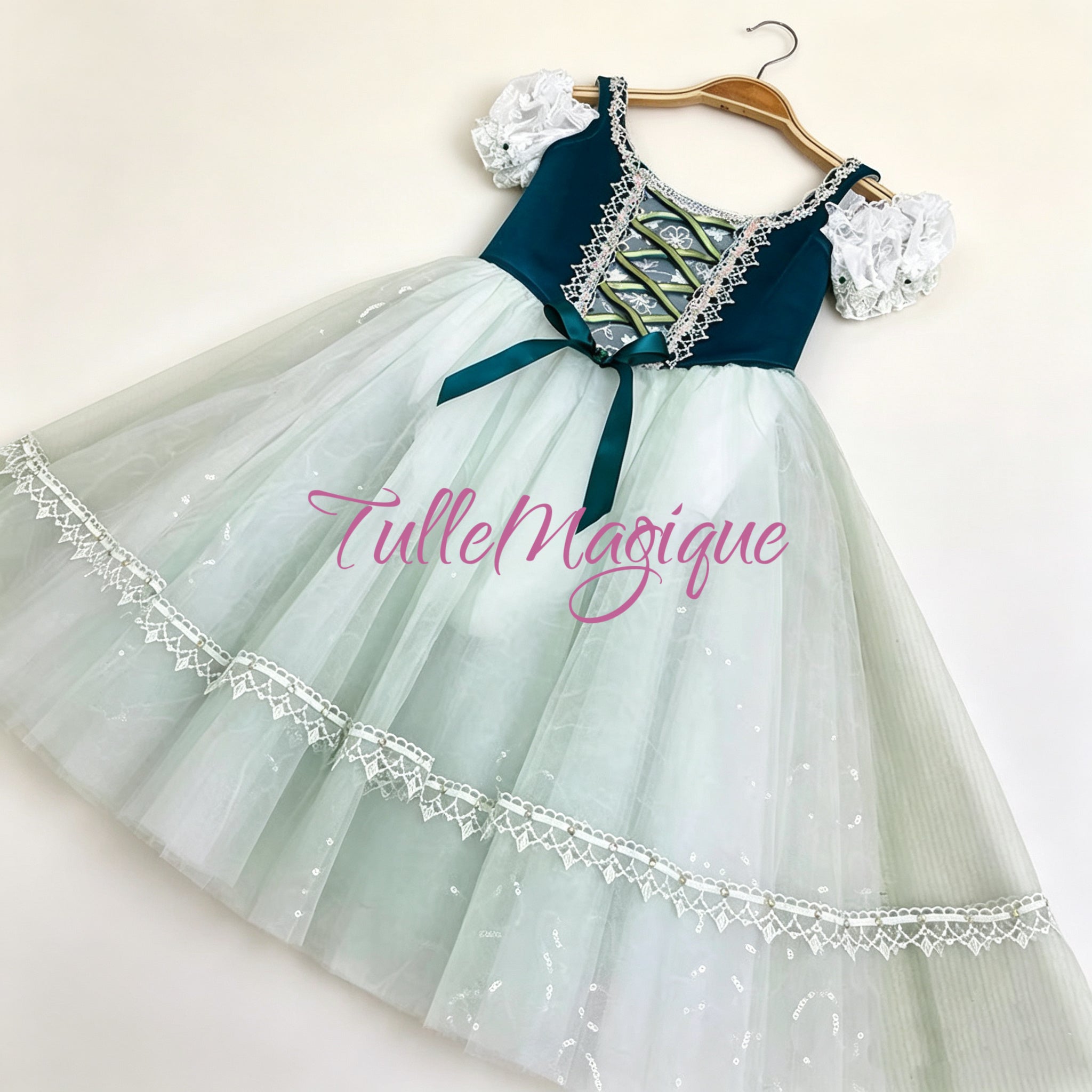 Romantic length white tulle ballet skirt with intricate white lace hemline trim, designed for professional stage performances and YAGP competitions.