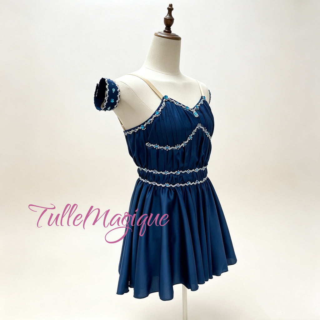 ⁠Deep midnight blue Grecian chiton style ballet dress with exquisite turquoise beaded trims and sweetheart neckline.⁠