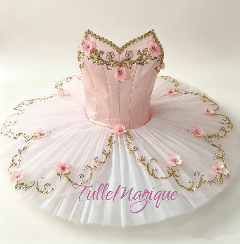 Professional pale soft pink and gold classical ballet tutu for Princess Aurora variation in Sleeping Beauty, Dew Drop in the nutcrackers featuring a soft pink satin bodice with gold baroque embroidery and 3D pink flowers for YAGP.