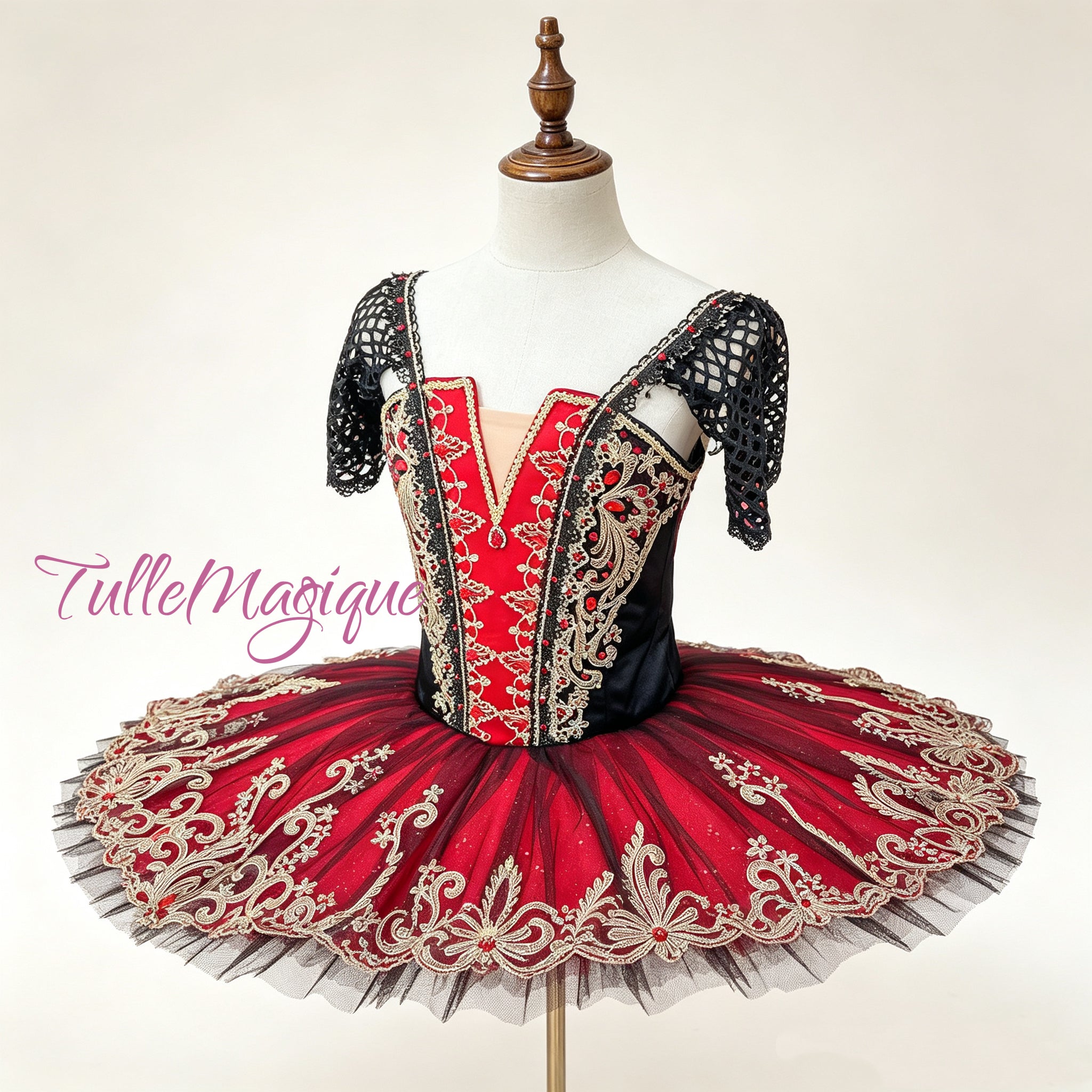 Professional red and gold classical ballet tutu for Paquita or Spanish dance repertoire, featuring a red-black paneled corset bodice with heavy gold baroque embroidery and black mesh sleeves for YAGP.